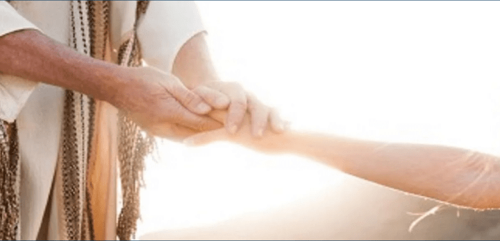 Jesus holding a hand