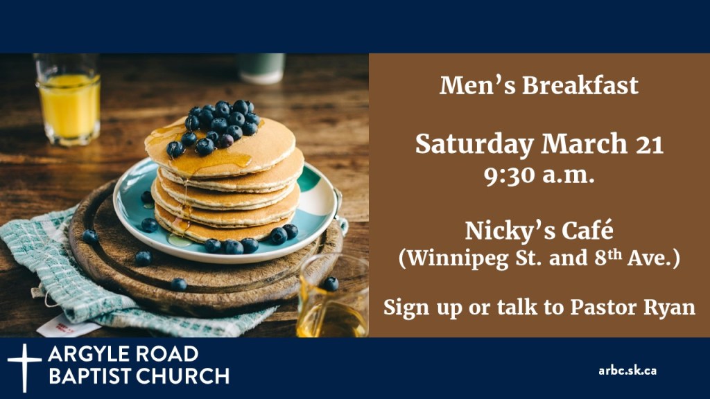 stack of pancakes with blueberries on a plate. Orange juice in the background.