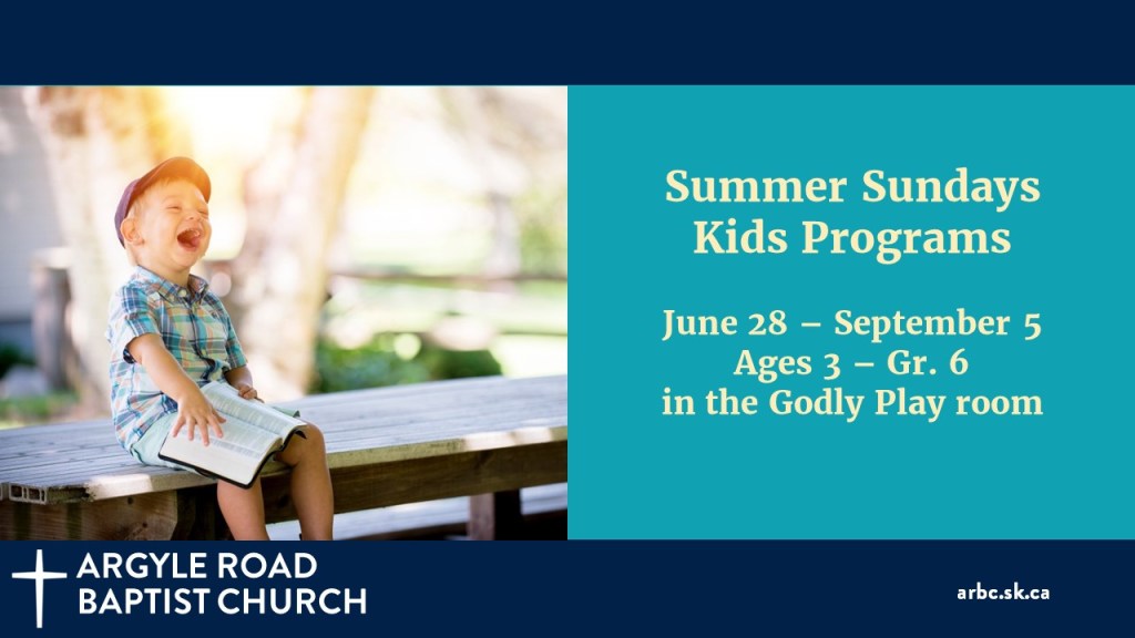 young boy delighted to be holding his Bible in the sunshine