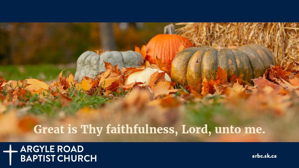 Orange, green, blue, and white pumpkins against a straw bale, with caption "Great is Thy faithfulness, Lord, unto me."